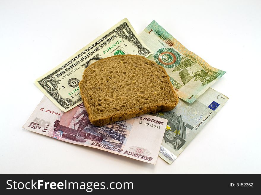 Money and bread on a white background