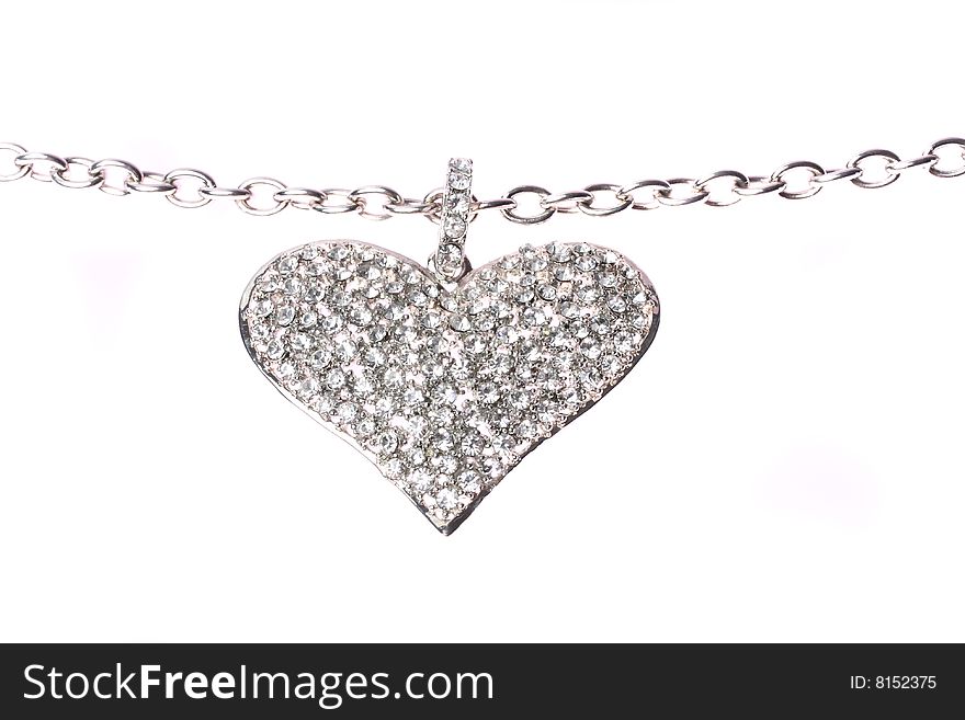 A silver heart on a white background