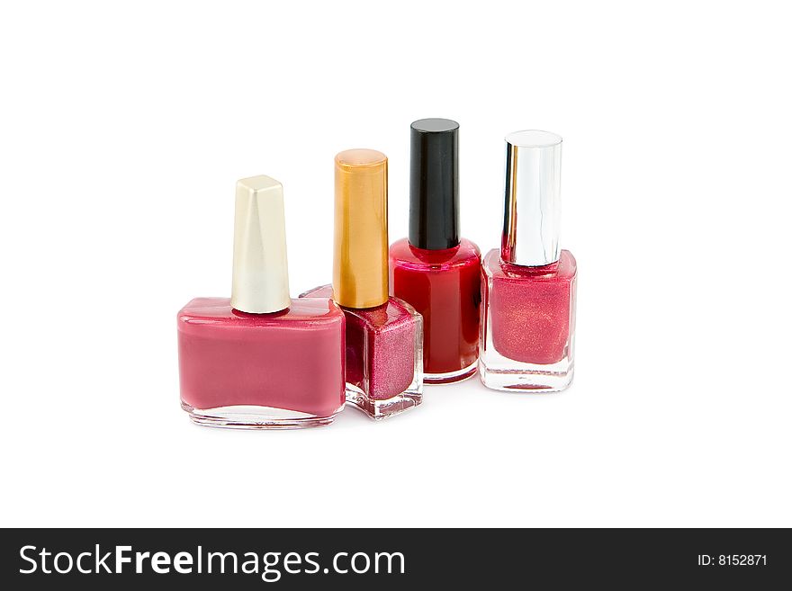 Group of pink and red nail polish on white background