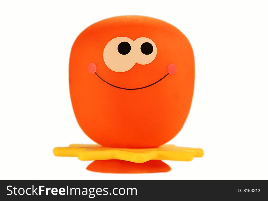 Orange toy on the white background