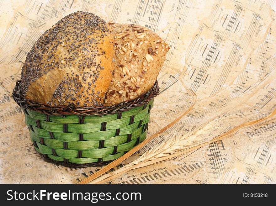 Bread and wheat as a giving on music sheet. Bread and wheat as a giving on music sheet