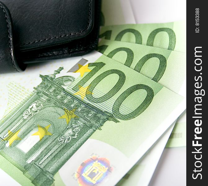 Euro and a leather purse closeup