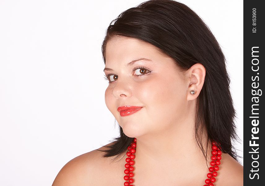 Young female with bright red lips and red necklace of beads. Young female with bright red lips and red necklace of beads