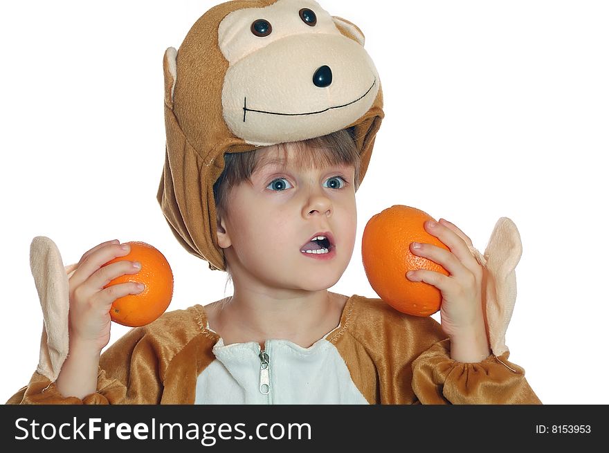 Girl wearing a costume of a monkey with two oranges. Girl wearing a costume of a monkey with two oranges