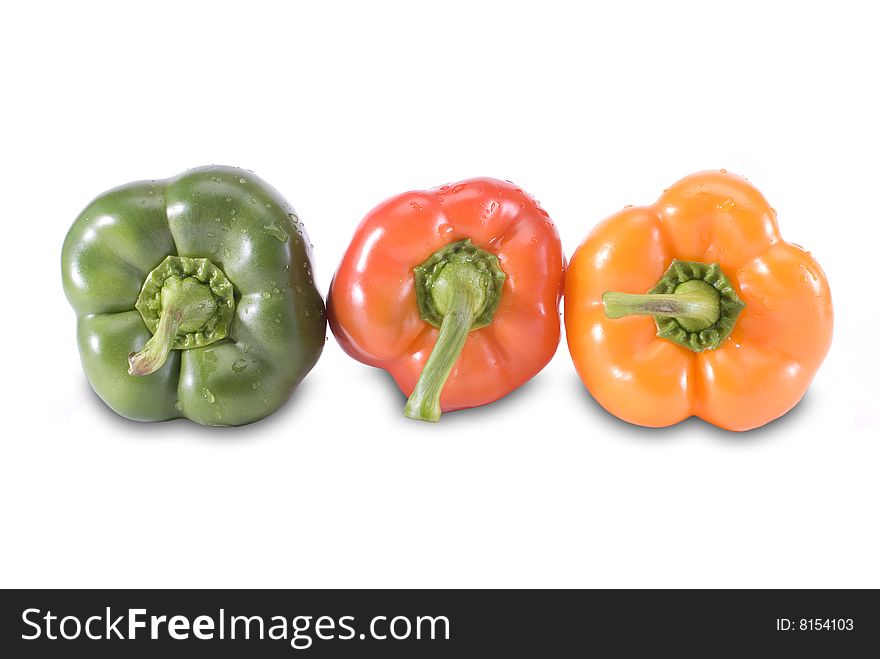 Three colored paprika in row