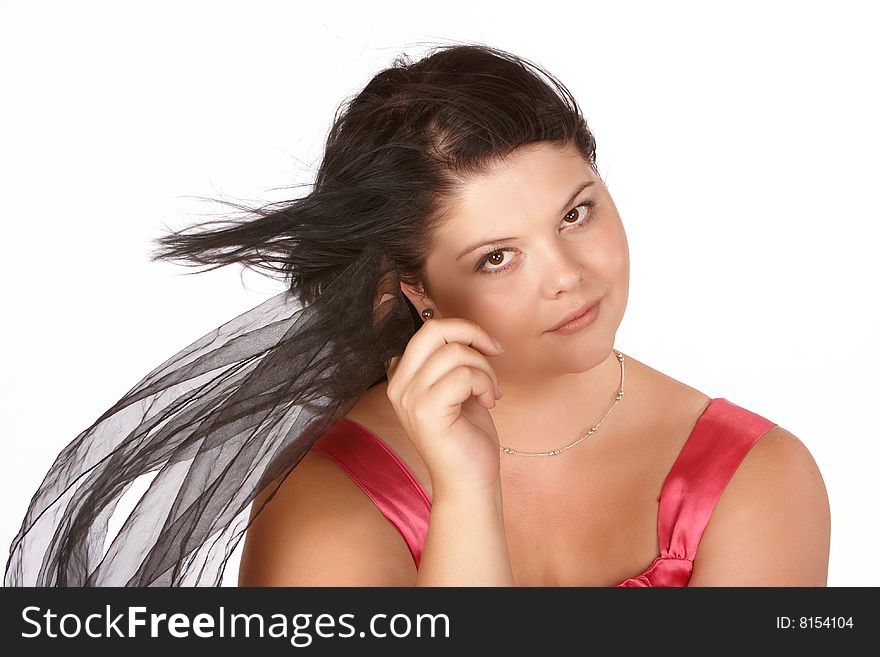 Young female model with hair blown by wind holding veil. Young female model with hair blown by wind holding veil