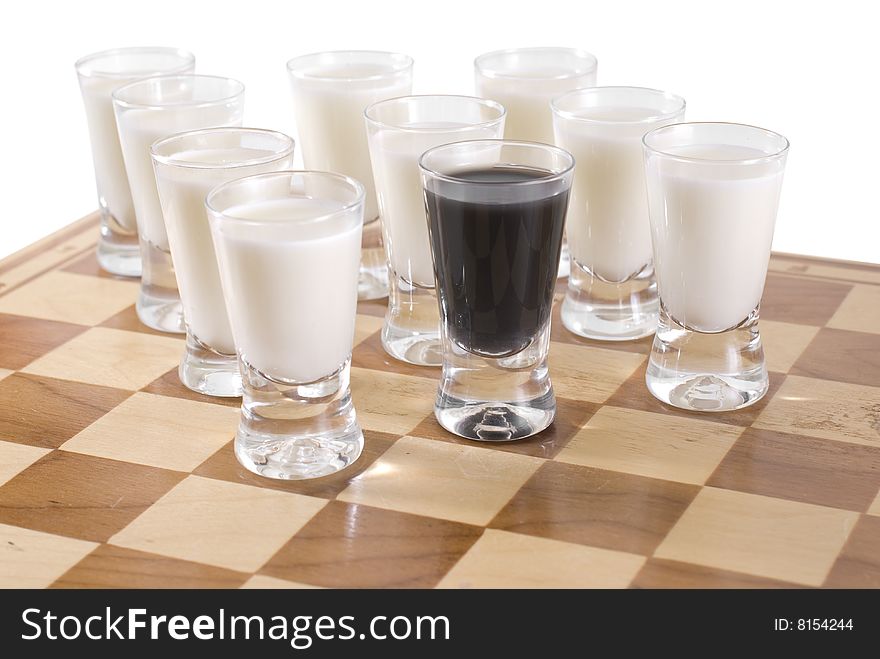 Chess table with glasses of drink. Chess table with glasses of drink