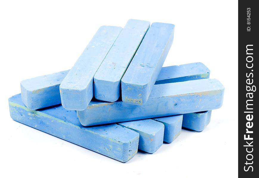 Stacked group blue chalk on white background