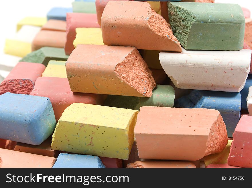 Group of crushed colored childrens chalk stacked in pyramid. Group of crushed colored childrens chalk stacked in pyramid