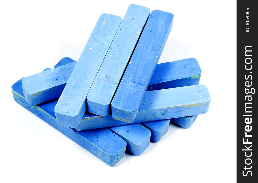 Stacked group blue chalk on white background