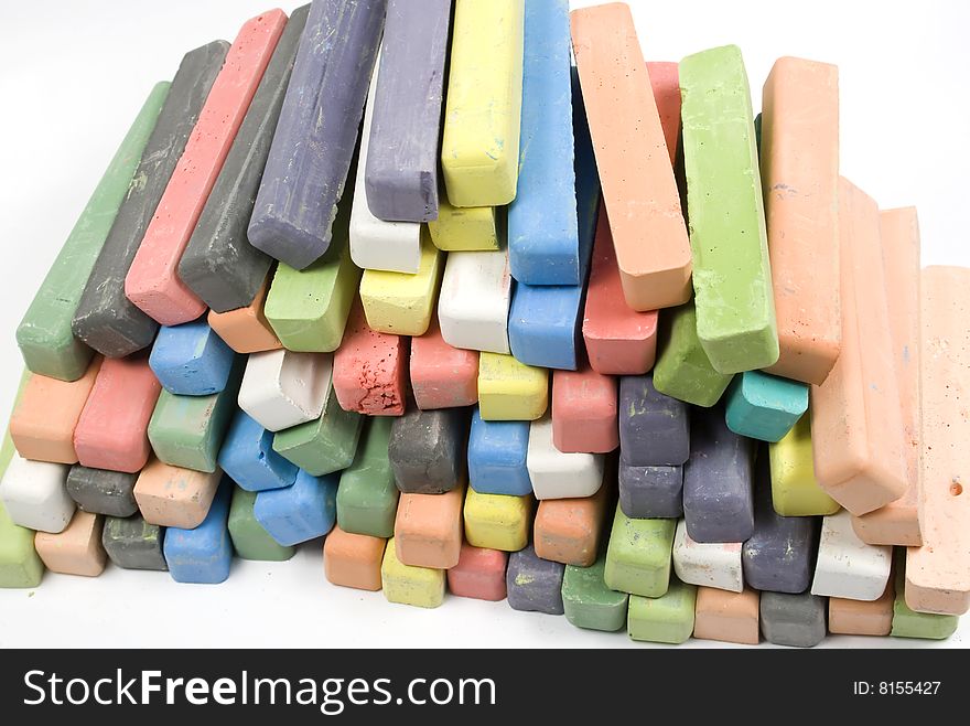 Set of colored chalk stacked in rows