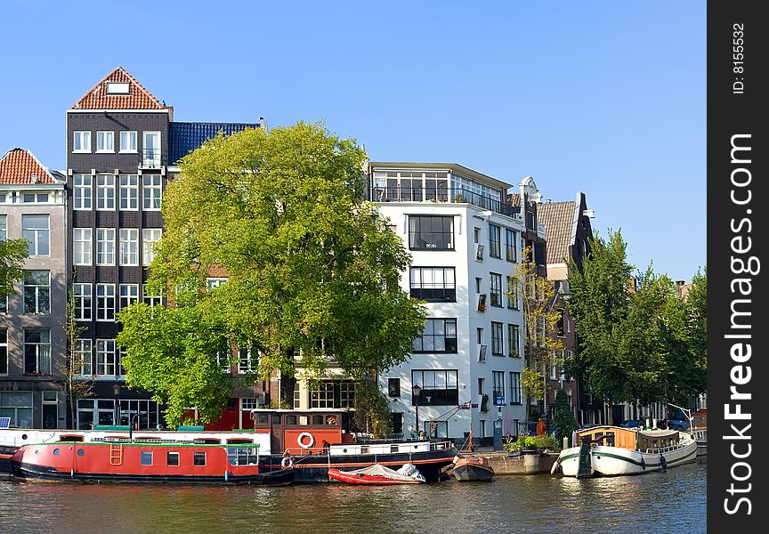 A number of the old houses which are standing along channels in Amsterdam. A number of the old houses which are standing along channels in Amsterdam