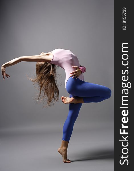 Stylish and young modern style dancer is posing