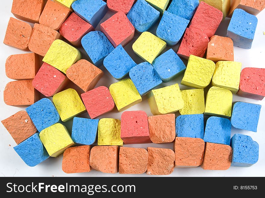 Set of mixed colored crushed childrens chalks in vertical. Set of mixed colored crushed childrens chalks in vertical