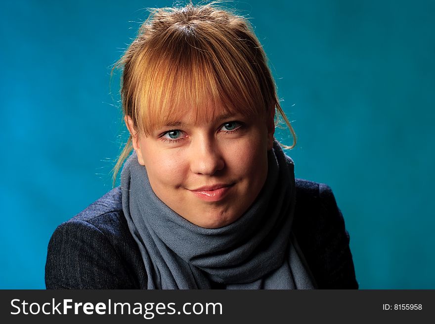 Portrait of female on a blue background in studio