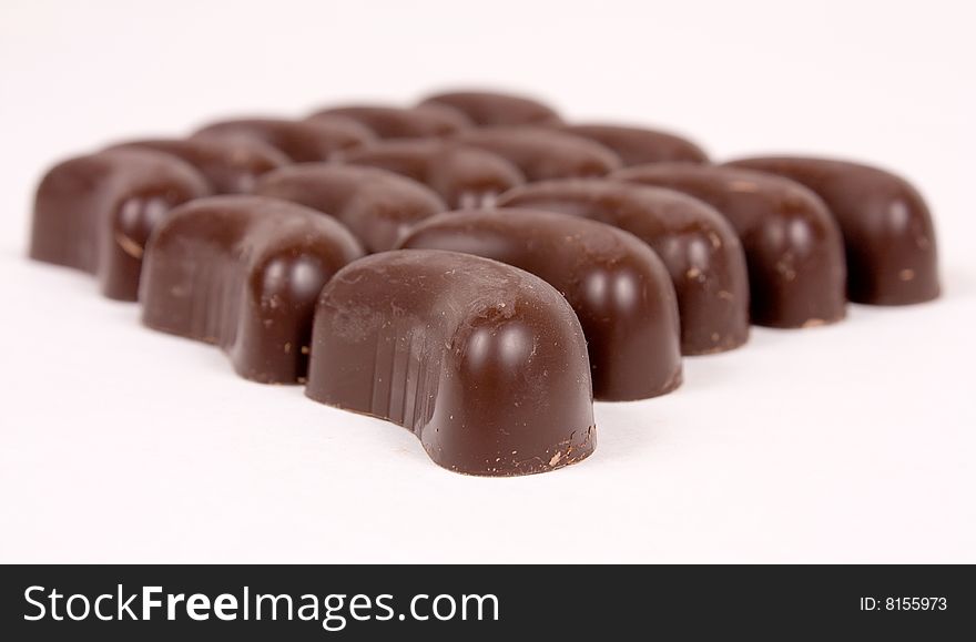 Group of chocolate candies on white background