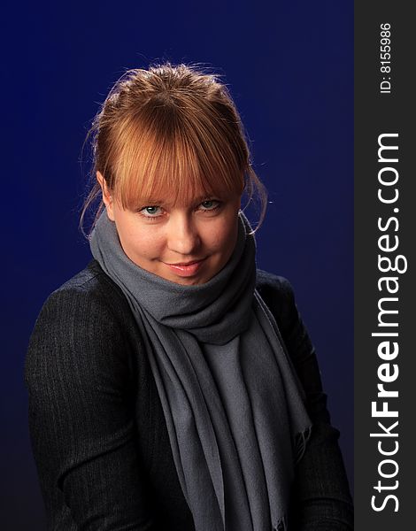 Portrait of female on a blue background in studio