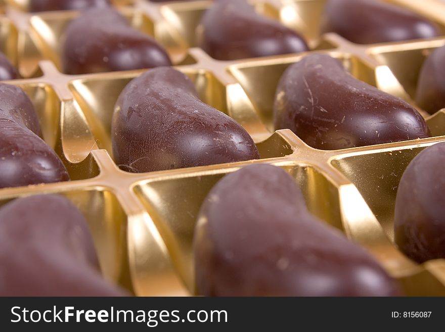 Rows of chocolate candies in box
