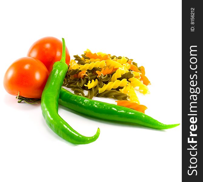 Fresh vegetables and pasta on white background