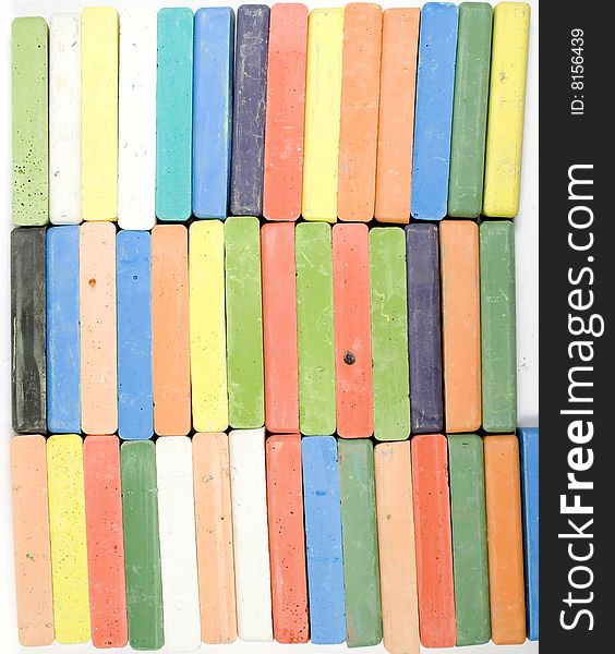 Colored background from three horizontal rows of  chalks