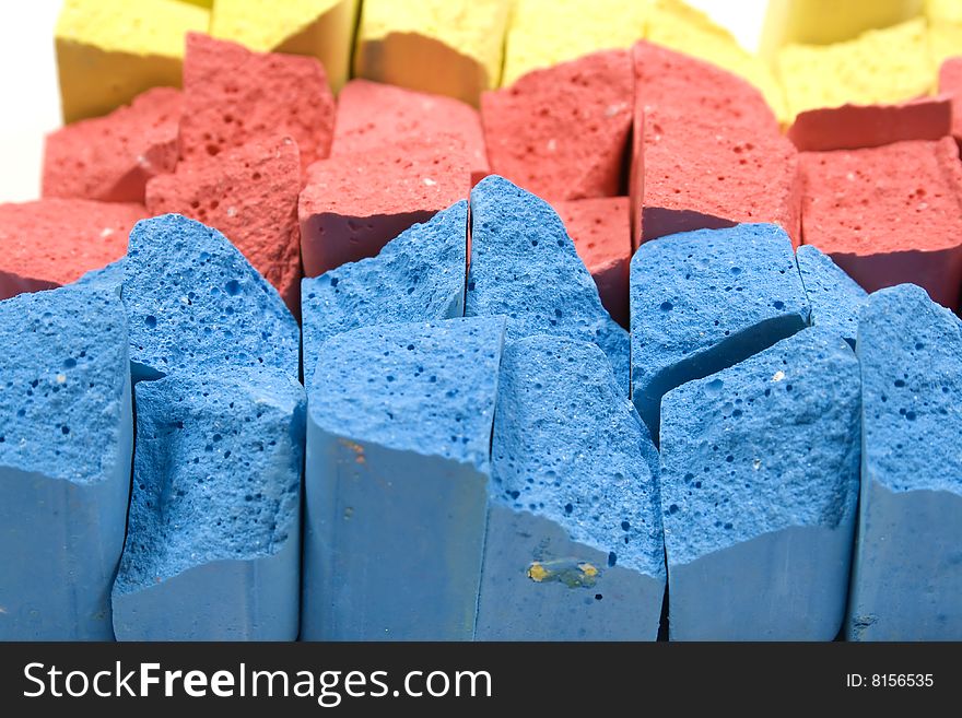 Stacked in rows group colored crushed chalks. Stacked in rows group colored crushed chalks