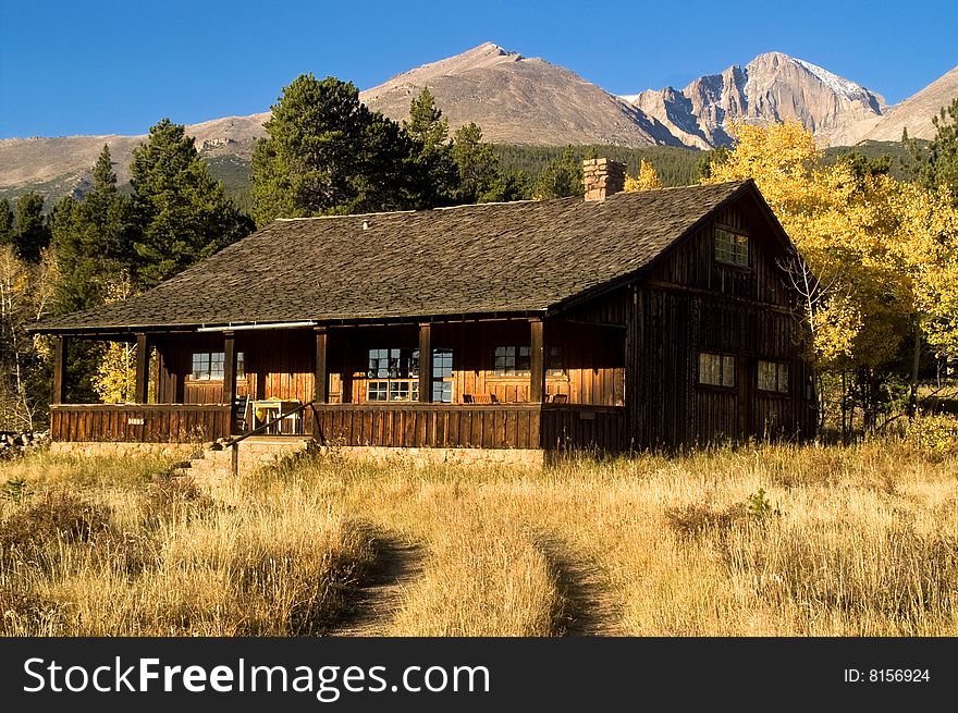 A country cabin in Colorado in Autumn with Aspen trees. A country cabin in Colorado in Autumn with Aspen trees