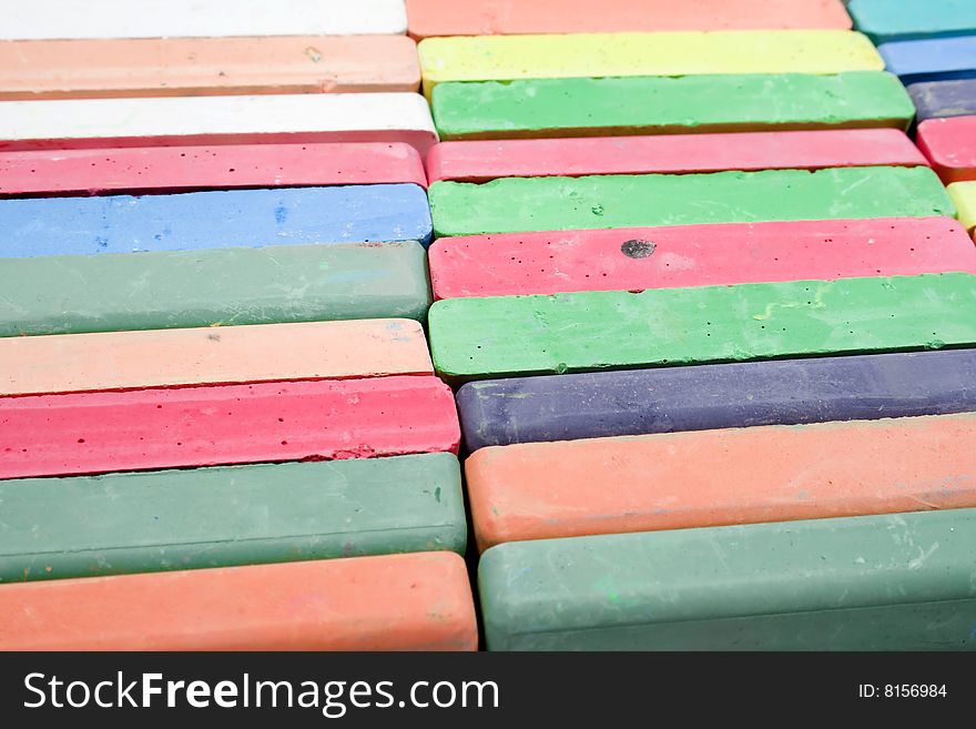 Set of colored chalk stacked in rows