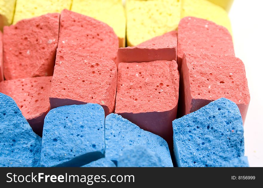 Stacked in rows group colored crushed chalks. Stacked in rows group colored crushed chalks