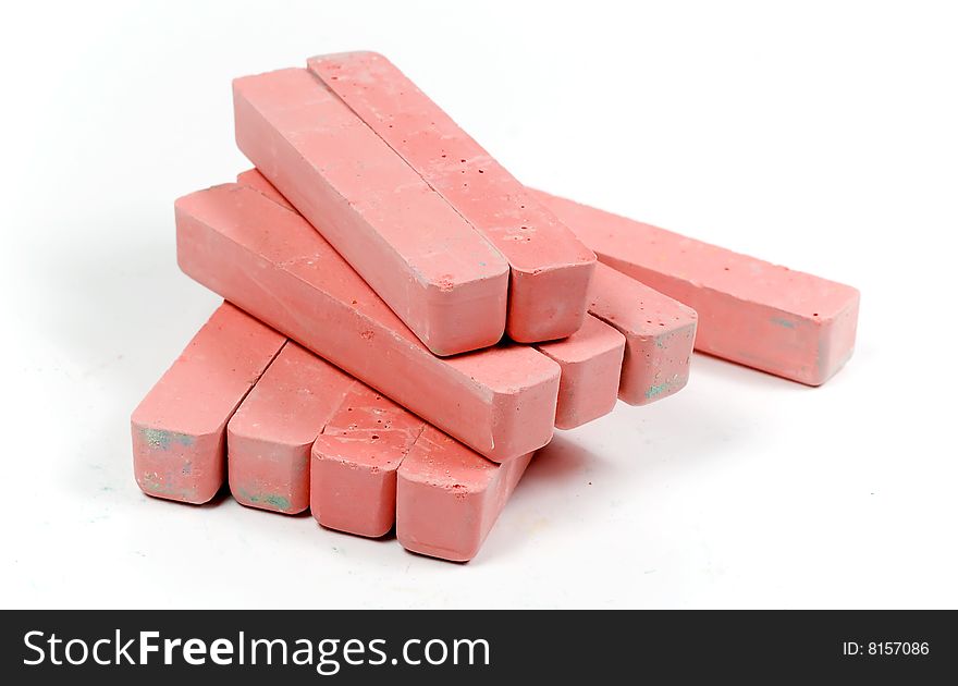 Stacked group red chalk on white background