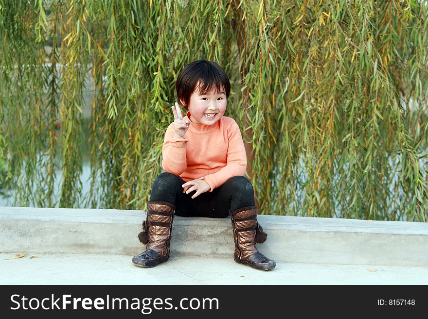 A lovely Chinese children to play outdoors.