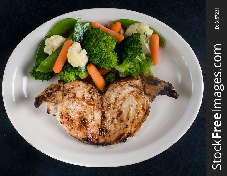 Baked chicken with steamed vegetables