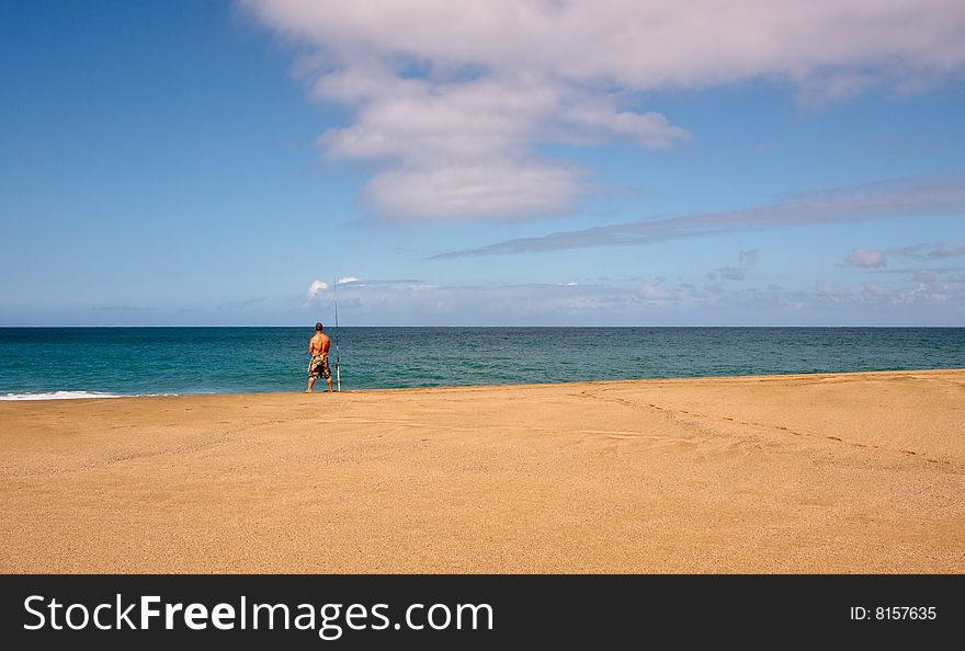 Sea fisherman on an empty beach