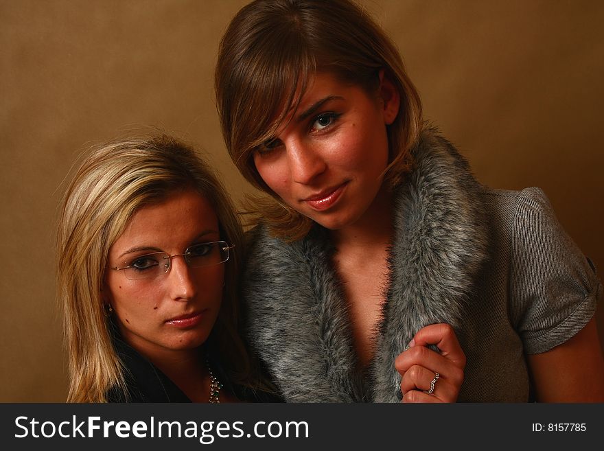 Two women, elegant. best friends in the soft light of a studio. Two women, elegant. best friends in the soft light of a studio