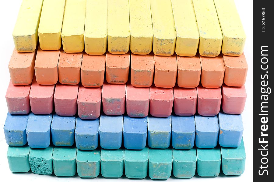 Five colors childrens chalk, stacked in rows