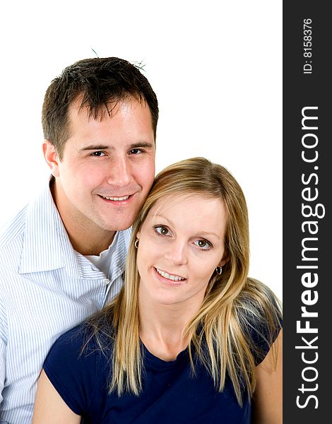 Attractive couple sitting together. Isolated on white background.