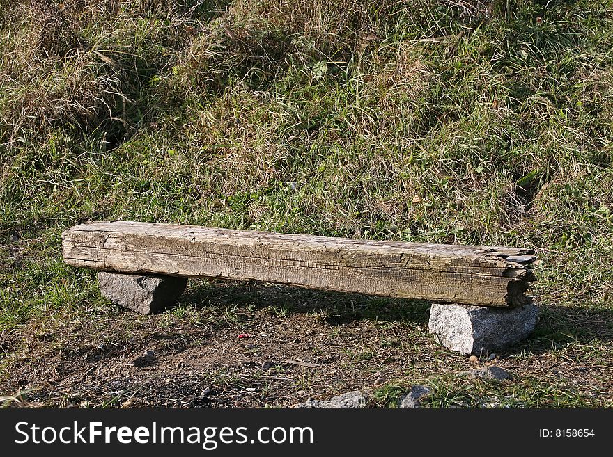 Bench made of make-shifts - an old cross tie and stones