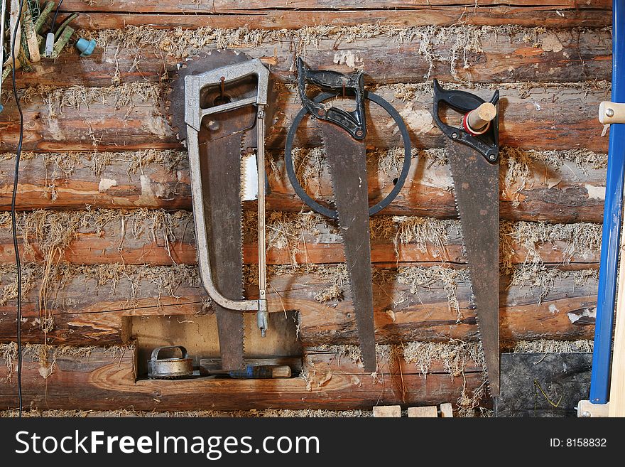 Hacksaws on a wall of the rural house