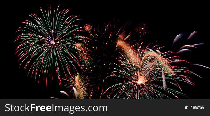 Bright colored fireworks on black background