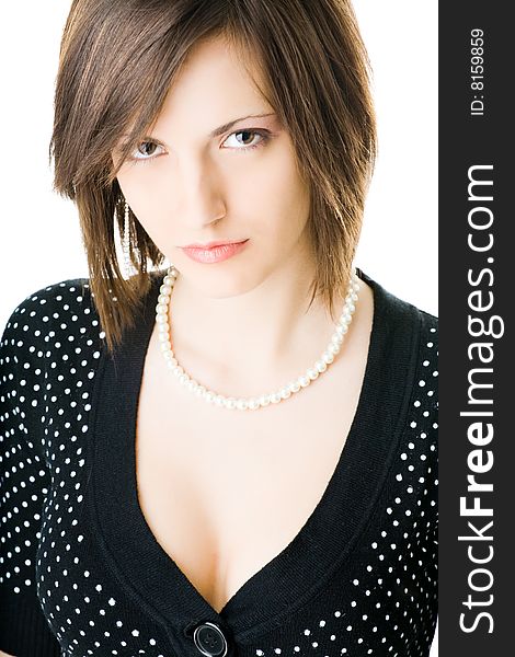 Portrait of young adult woman with pearl necklace isolated