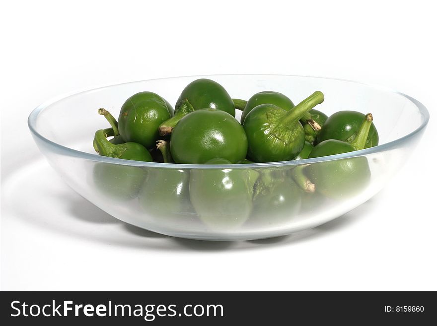 Green hot chili peppers in isolated background