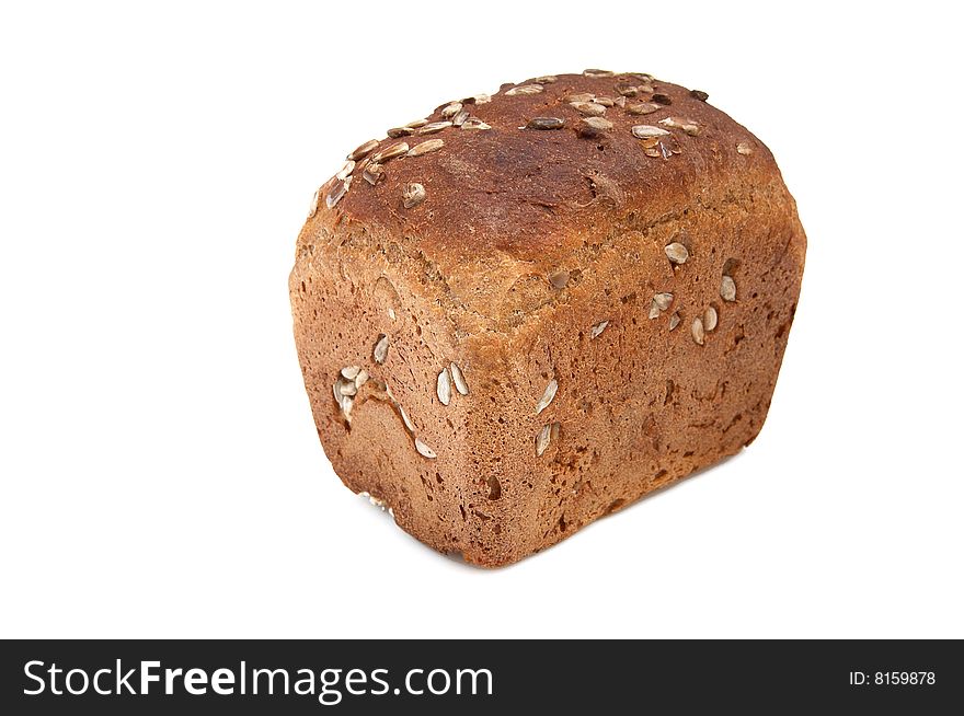 Loaf of bread full of seeds isolated on a white background. Loaf of bread full of seeds isolated on a white background.