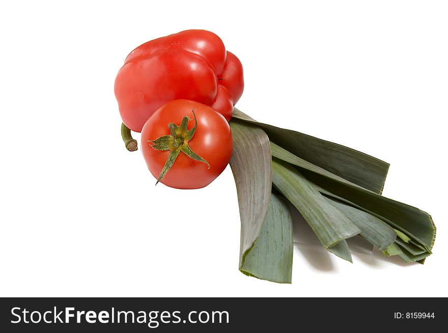 Leek,pepper and tomato isolated  on a white background. Leek,pepper and tomato isolated  on a white background.