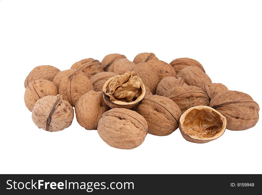 Heap fresh walnuts isolated  on a white background. Heap fresh walnuts isolated  on a white background.