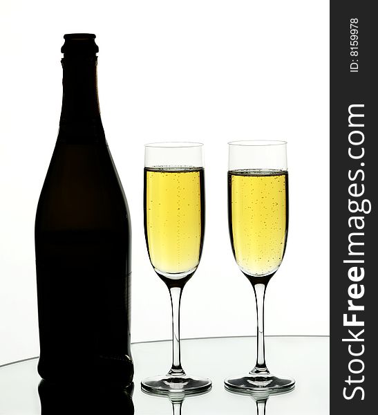 Two glasses of champagne on isolated white background. Two glasses of champagne on isolated white background