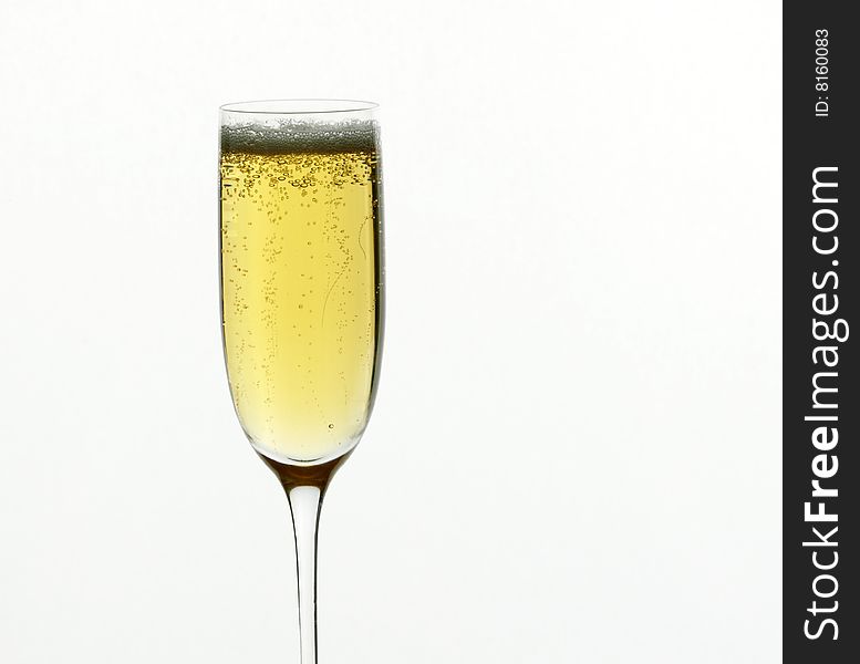 A champagne flute against a white background.