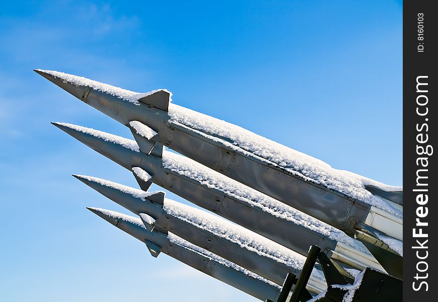 Anti-aircraft rockets at launch against blue sky