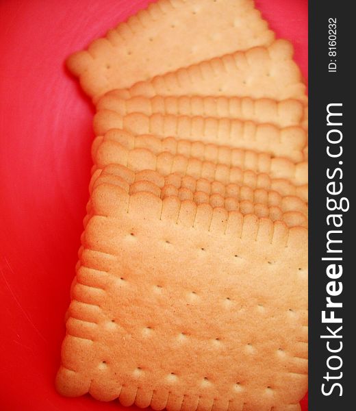 Many pieces of cookies isolated on red background. Many pieces of cookies isolated on red background