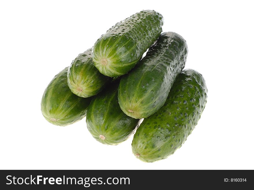 Heap fresh cucumbers isolated on white