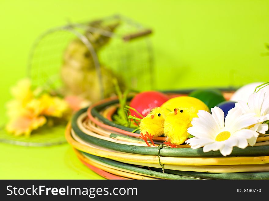 Easter decoration over the green background with shallow DOF