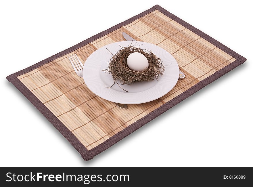 Egg in a nest served on a plate